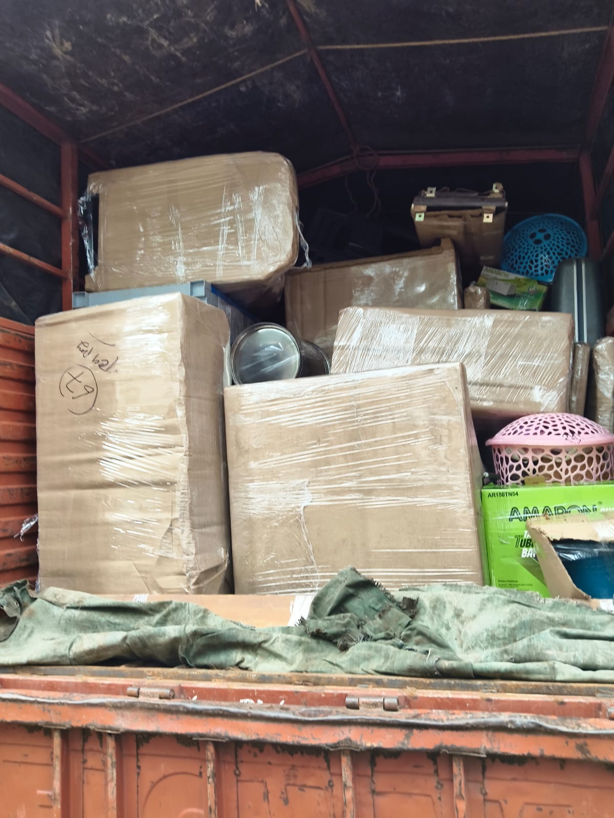 Packed household items inside moving truck
